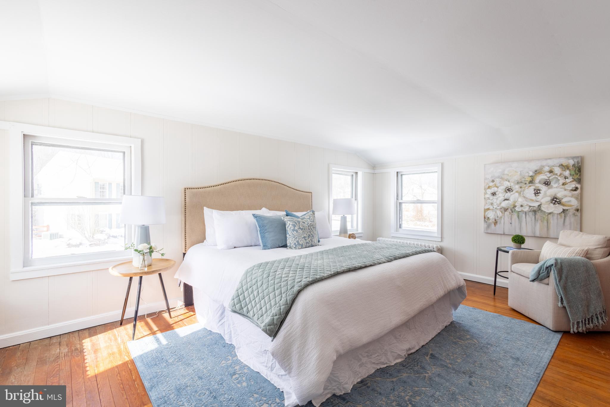 1301 Stump Road North Wales, PA 19454 - Photo 12 of 19 a bedroom with a bed and wooden floor