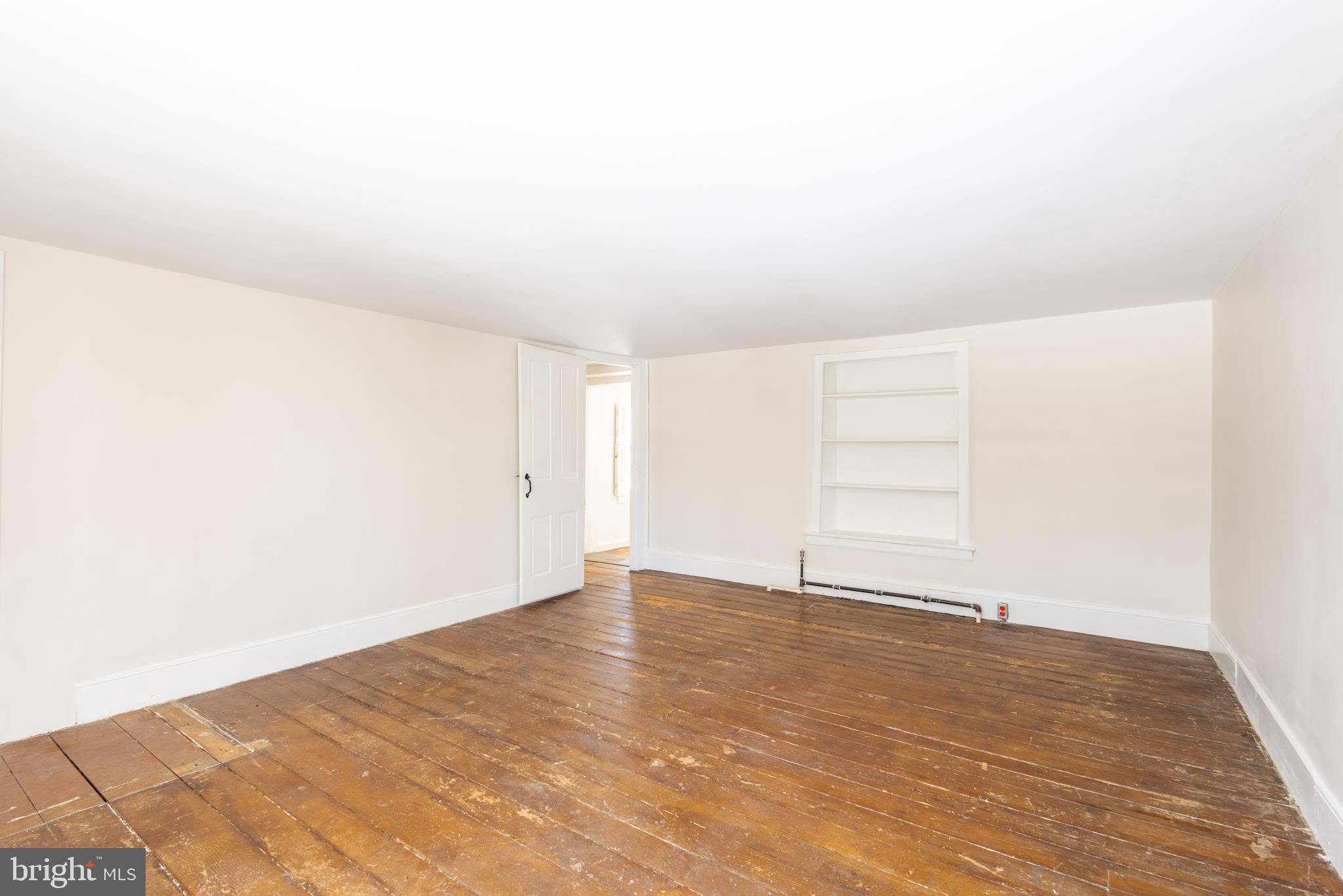 1301 Stump Road North Wales, PA 19454 - Photo 19 of 19 an empty room with wooden floor and windows