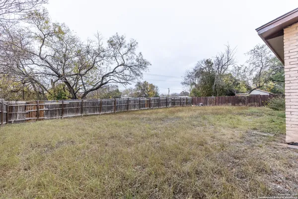 a backyard of a house with lots of green space