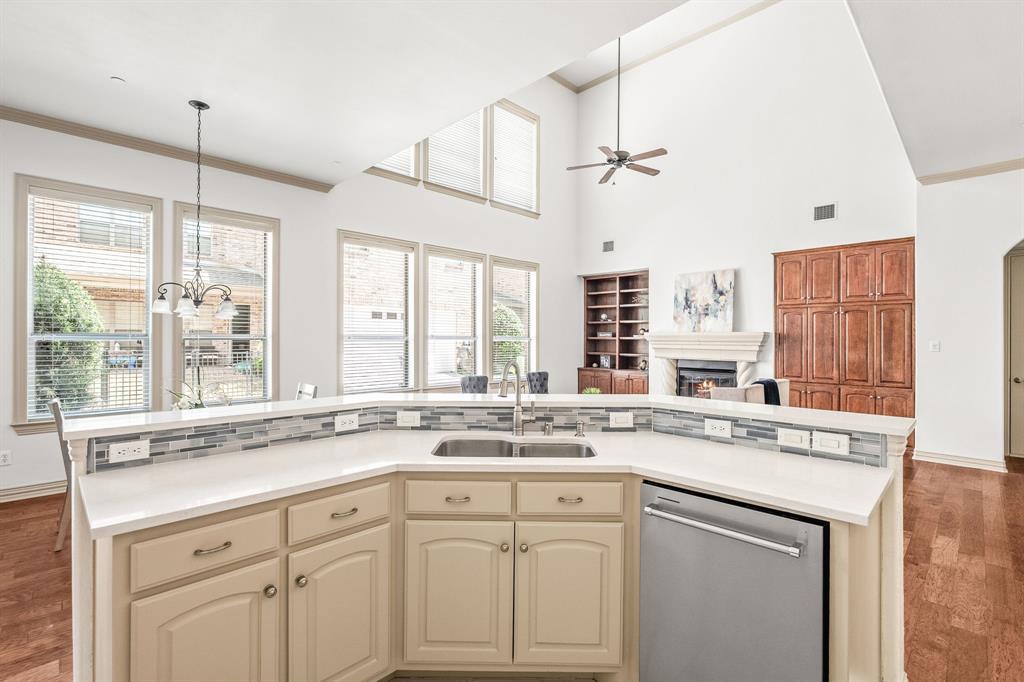 6393 Burnham Street Frisco, TX 75034 - Photo 17 of 30 a kitchen with a sink stove and cabinets
