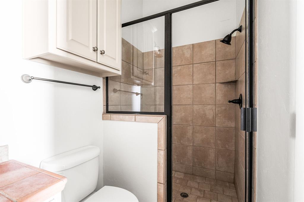 6393 Burnham Street Frisco, TX 75034 - Photo 20 of 30 a bathroom with a toilet and a shower