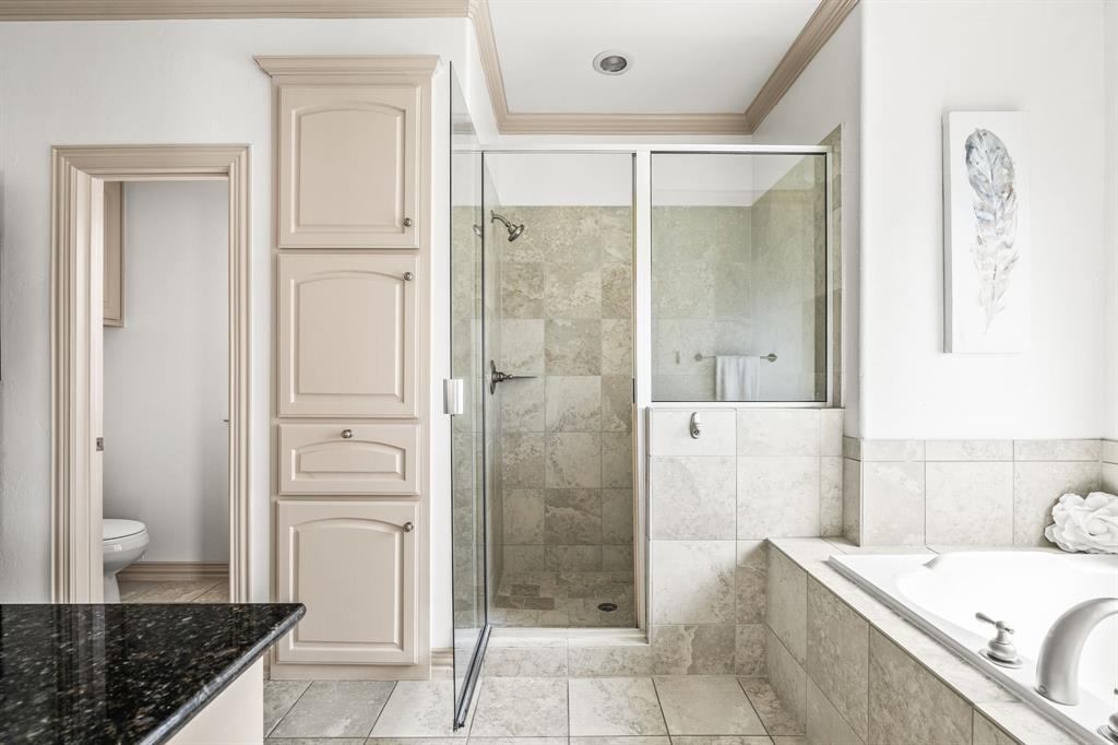 6393 Burnham Street Frisco, TX 75034 - Photo 27 of 30 a bathroom with a granite countertop sink a mirror and a shower