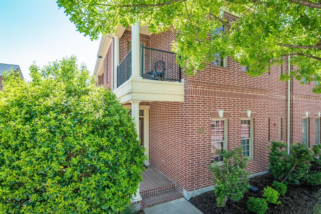 6393 Burnham Street Frisco, TX 75034 - Photo 30 of 30 a view of a brick house with a tree and plants