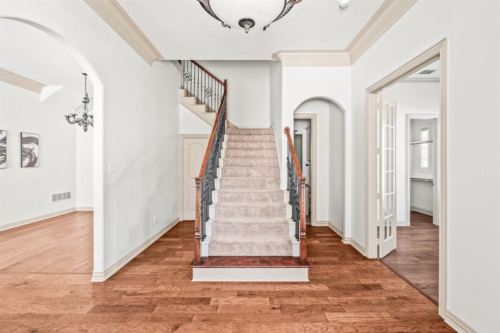6393 Burnham Street Frisco, TX 75034 - Photo 8 of 30 a view of entryway and hall with wooden floor