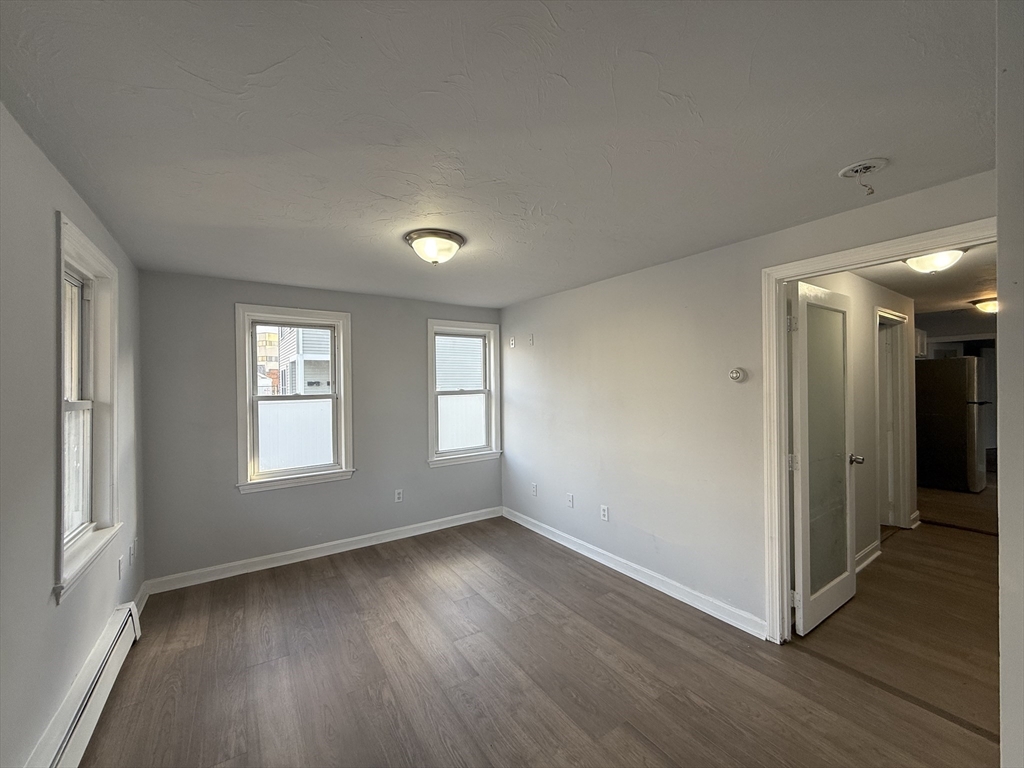 30 Sanger Street, Unit 1 Framingham, MA 01702 - Photo 2 of 15 a view of livingroom with hardwood