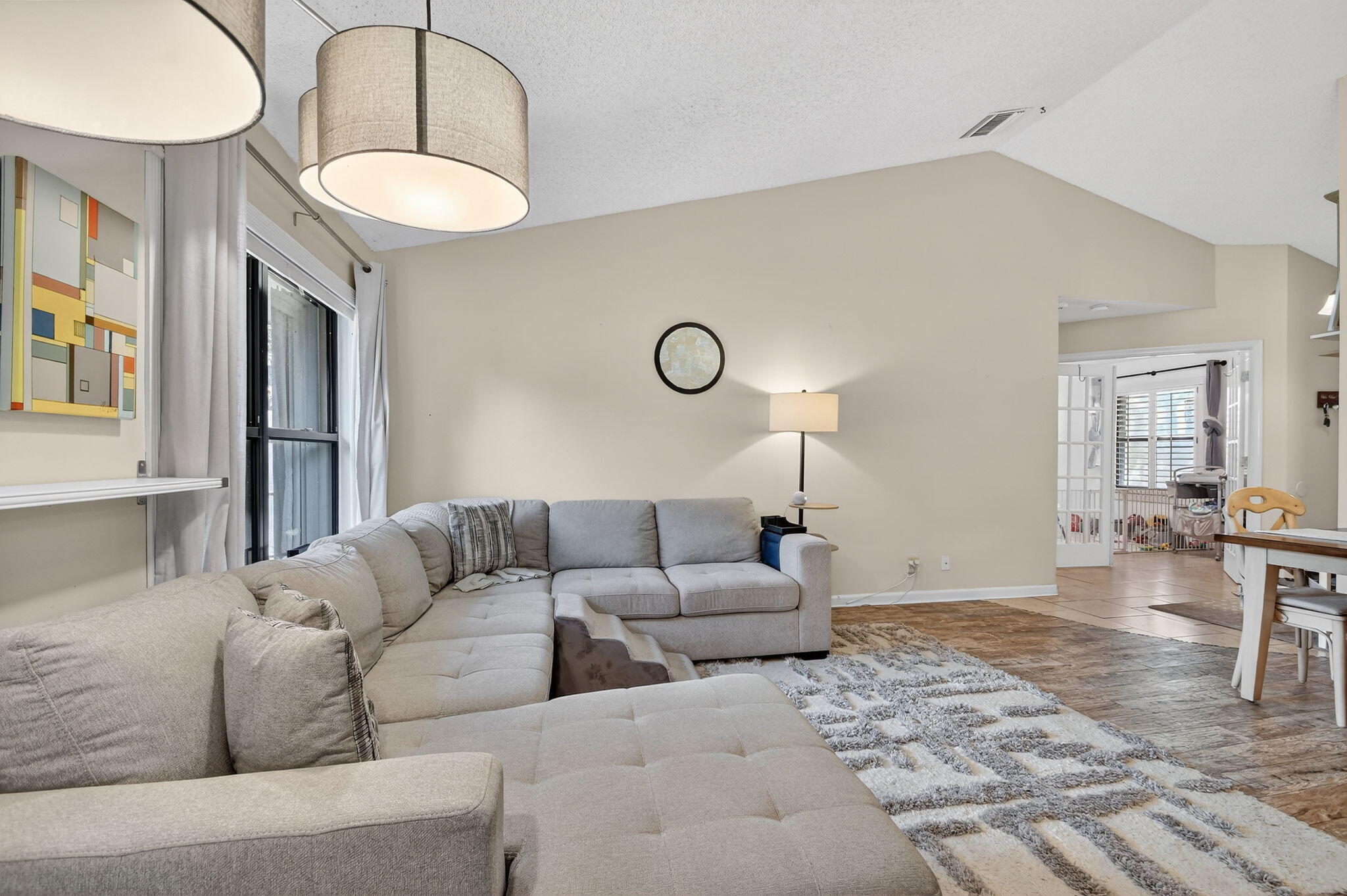 117 Vía De Casas Norte Boynton Beach, FL 33426 - Photo 11 of 31 a living room with furniture a table and chairs