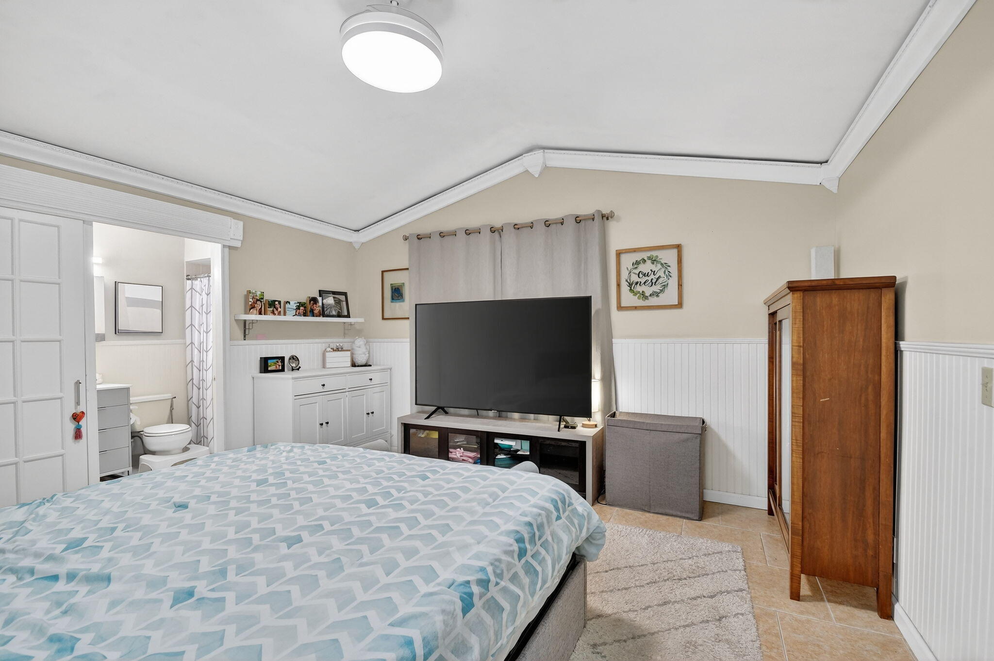 117 Vía De Casas Norte Boynton Beach, FL 33426 - Photo 13 of 31 a bedroom with a bed and a flat screen tv