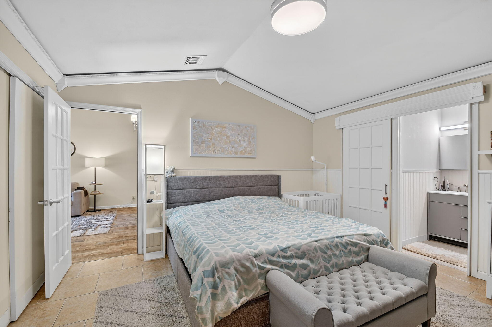 117 Vía De Casas Norte Boynton Beach, FL 33426 - Photo 14 of 31 a spacious bedroom with a bed and a couch