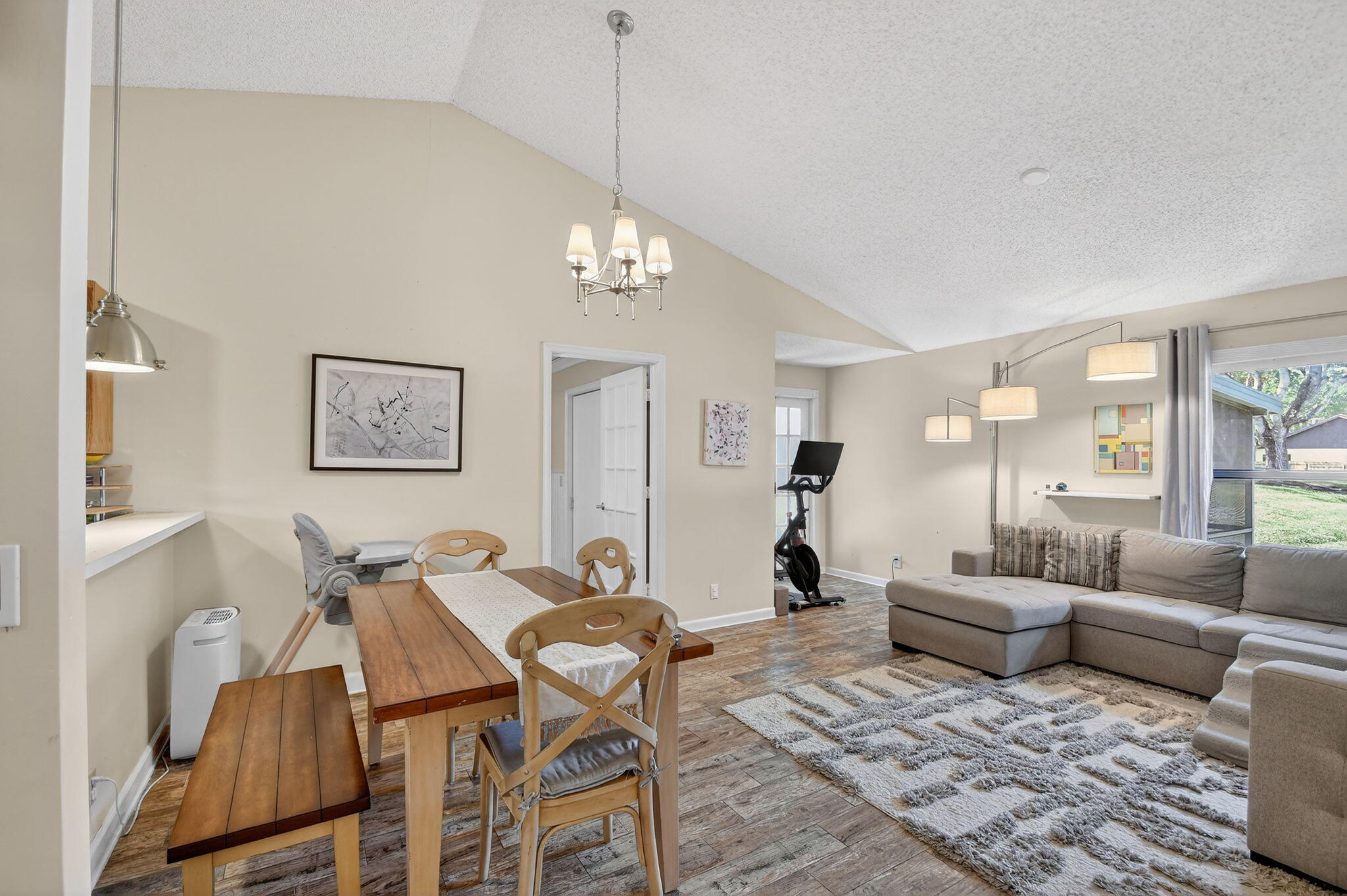 117 Vía De Casas Norte Boynton Beach, FL 33426 - Photo 8 of 31 a living room with furniture chandelier and a table