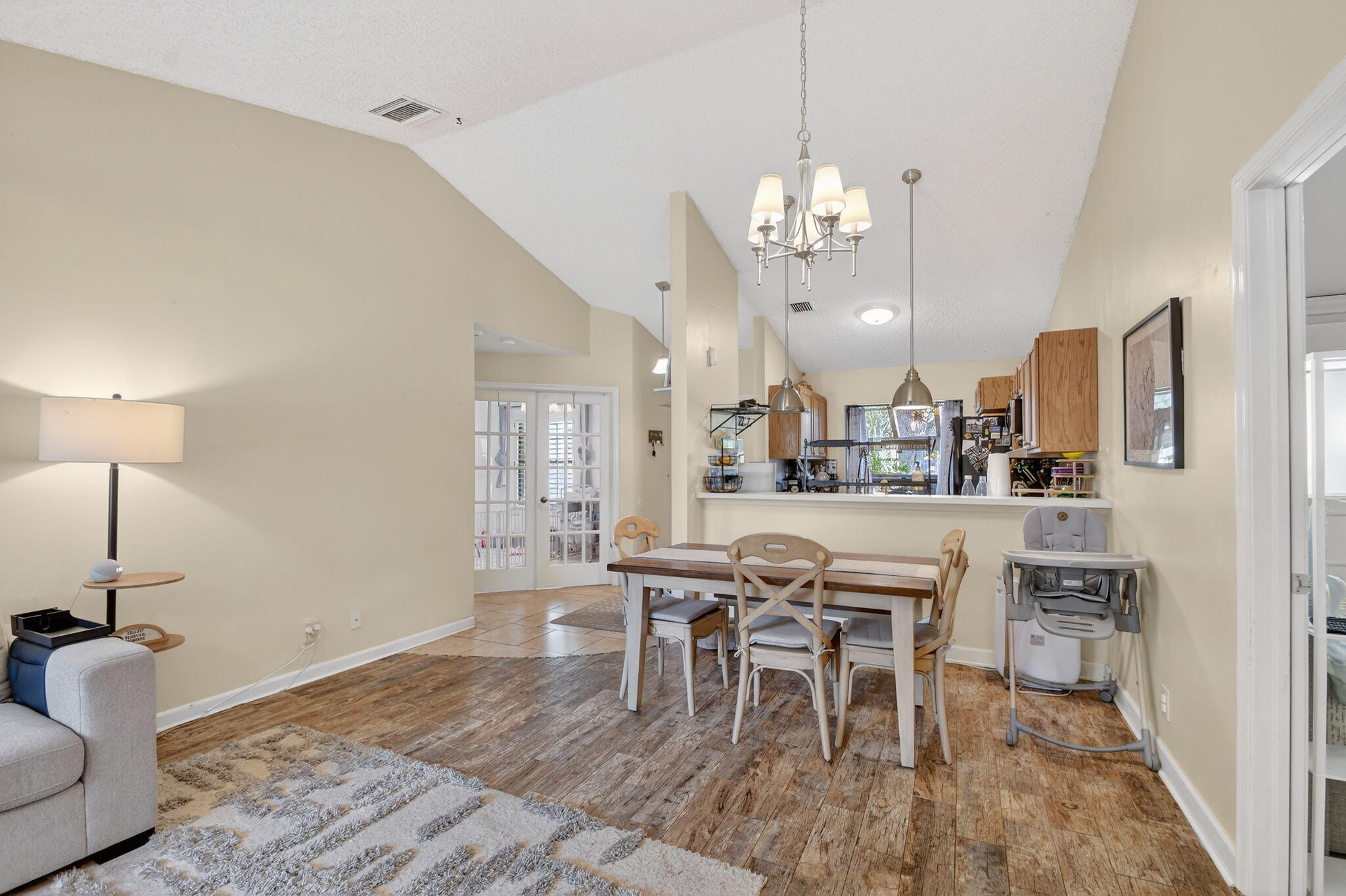 117 Vía De Casas Norte Boynton Beach, FL 33426 - Photo 9 of 31 a view of a dining room with furniture and chandelier