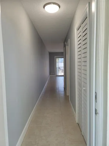 a view of a kitchen with microwave and stove top oven
