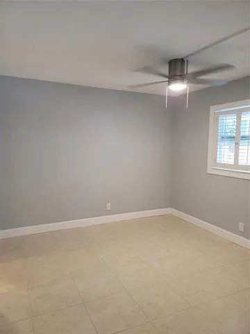 a bathroom with a toilet and a bath tub