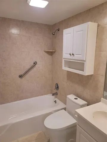 a terrace with outdoor seating and city view