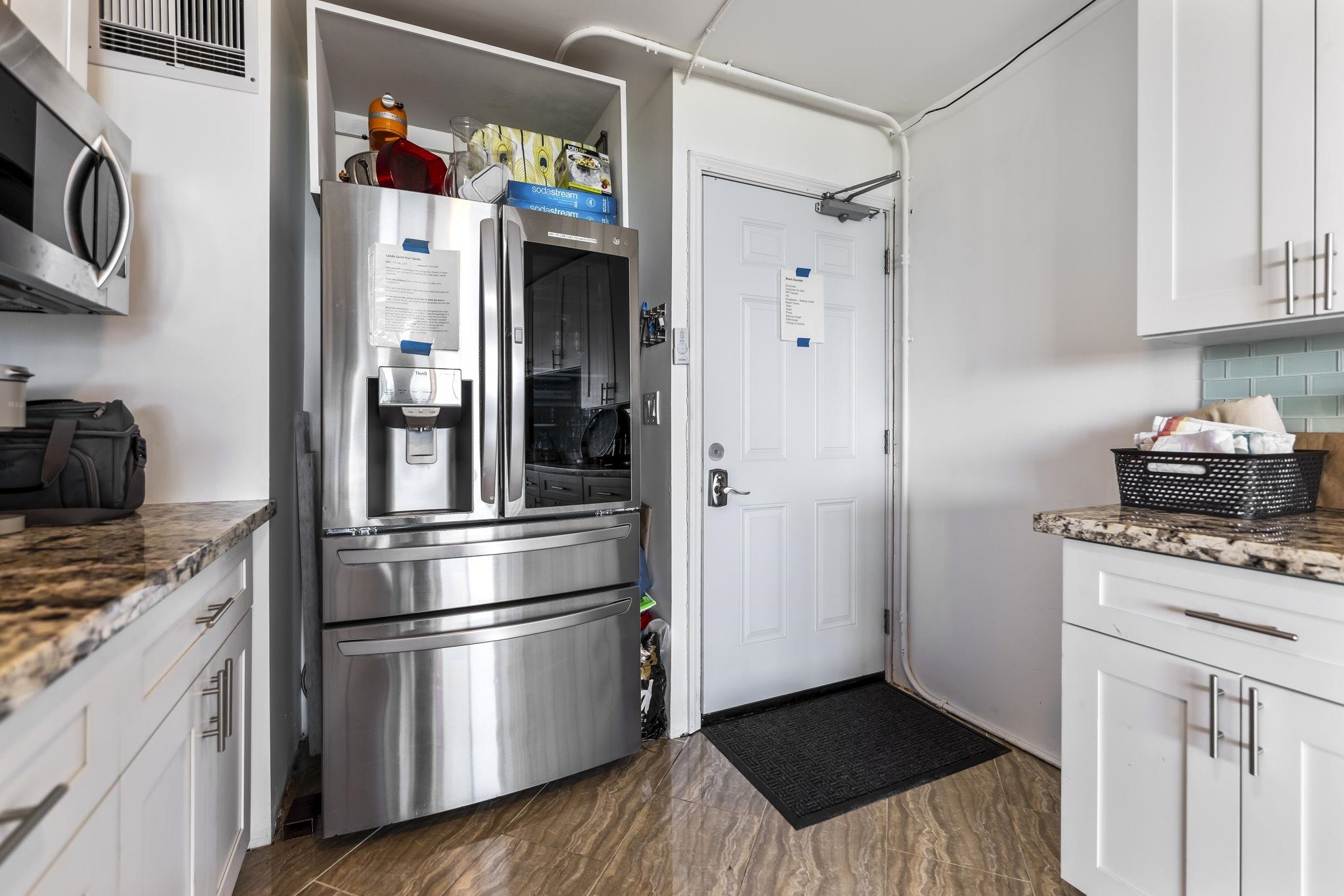 111 Kahului Beach Road, Unit A426 Kahului, HI 96732 - Photo 11 of 24 a kitchen with stainless steel appliances granite countertop a refrigerator and a stove top oven