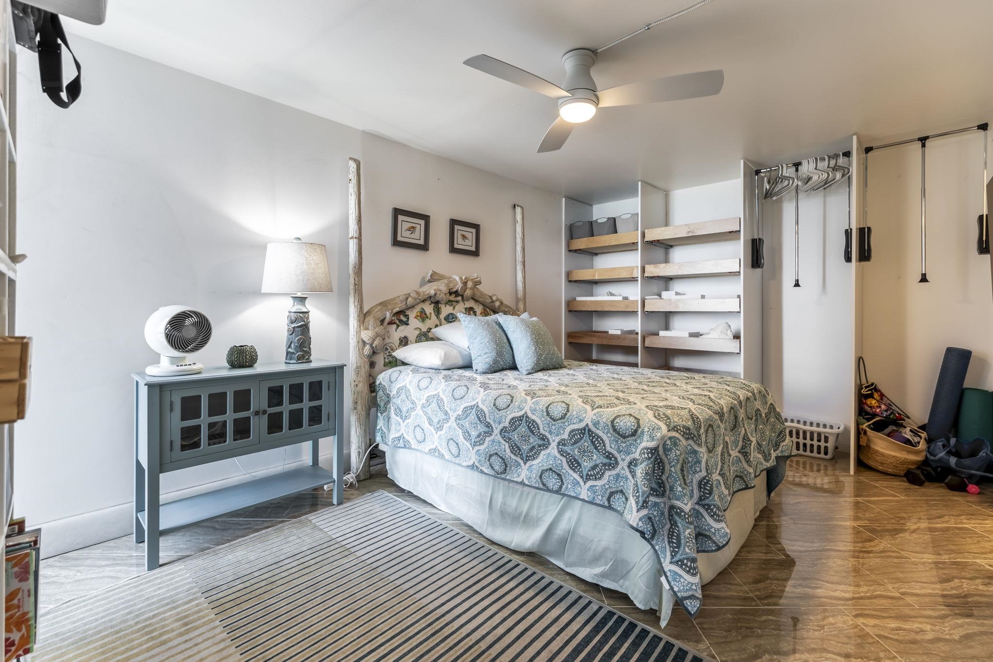 111 Kahului Beach Road, Unit A426 Kahului, HI 96732 - Photo 14 of 24 a bedroom with a large bed and a window