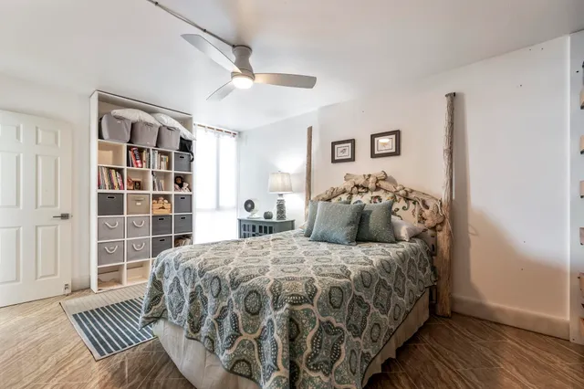 a bedroom with a bed and a walk in closet