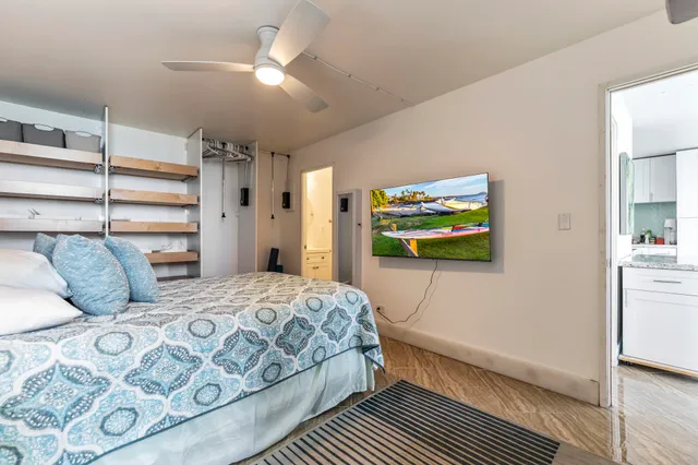 a bedroom with a bed and a cabinets