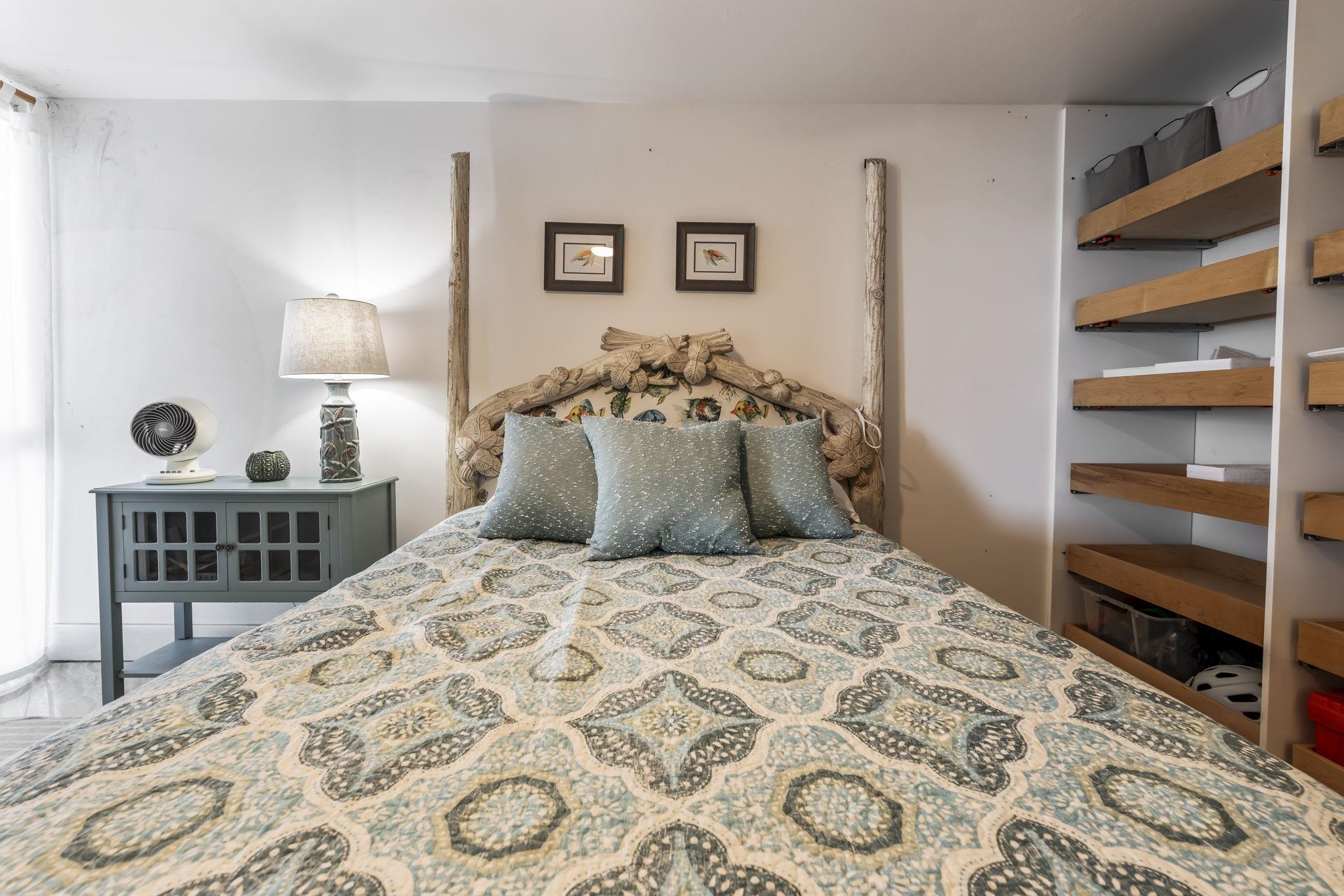 111 Kahului Beach Road, Unit A426 Kahului, HI 96732 - Photo 17 of 24 a bedroom with a bed and a cabinets