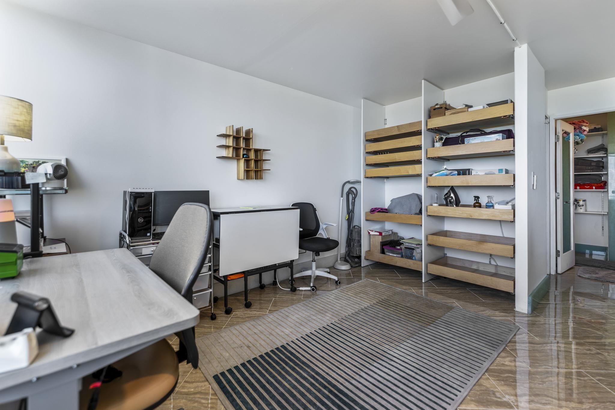 111 Kahului Beach Road, Unit A426 Kahului, HI 96732 - Photo 18 of 24 a room with furniture and a wooden floor