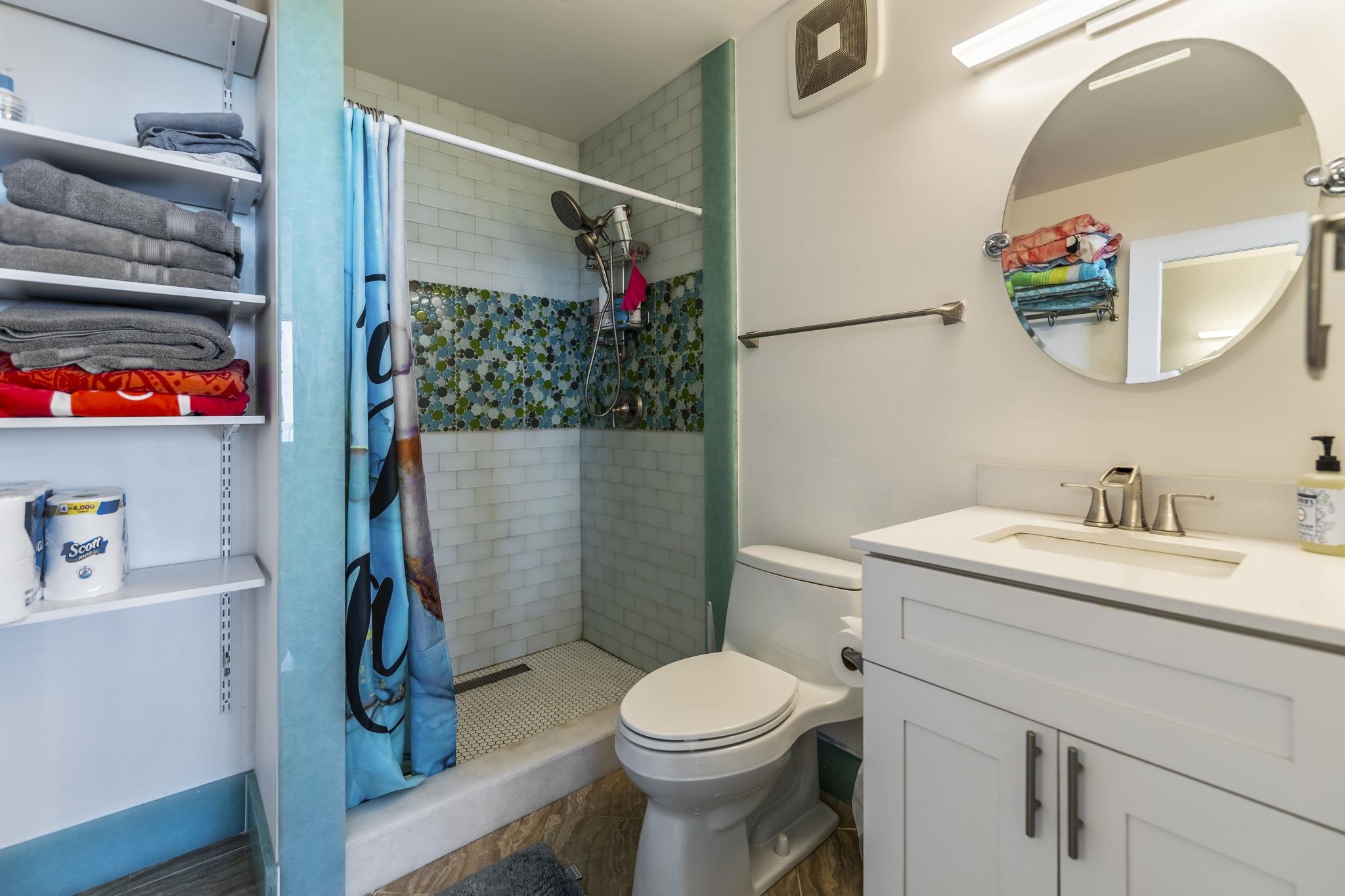 111 Kahului Beach Road, Unit A426 Kahului, HI 96732 - Photo 19 of 24 a bathroom with a sink a toilet and a mirror