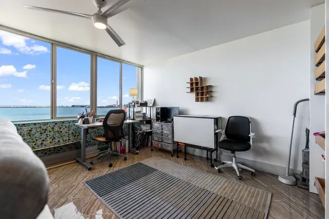 a workspace with furniture and a window