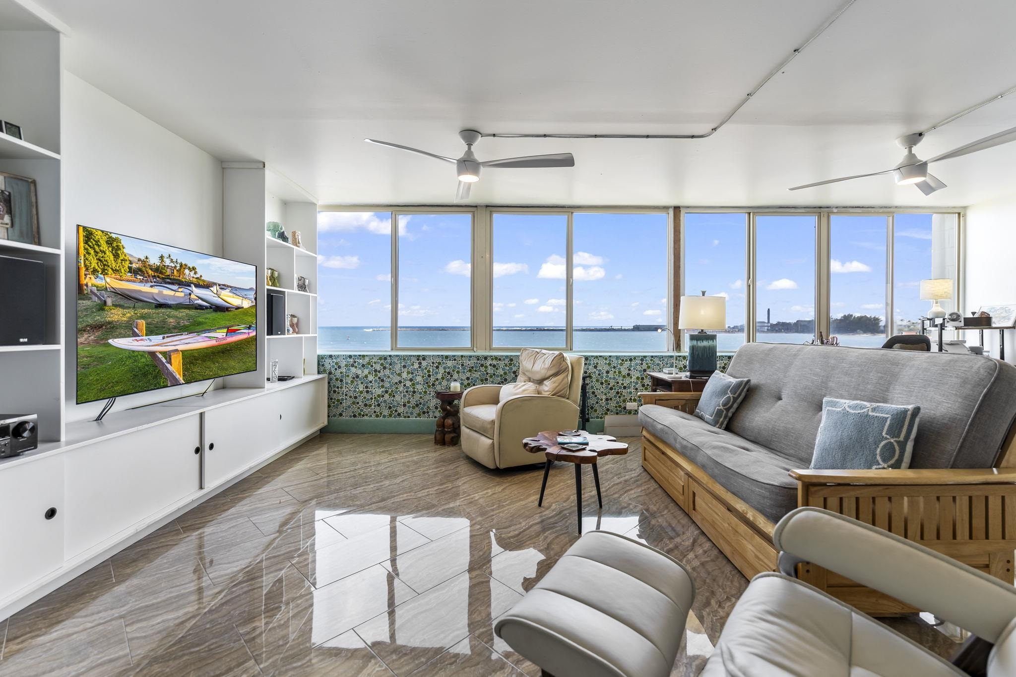 111 Kahului Beach Road, Unit A426 Kahului, HI 96732 - Photo 6 of 24 a living room with furniture and a flat screen tv