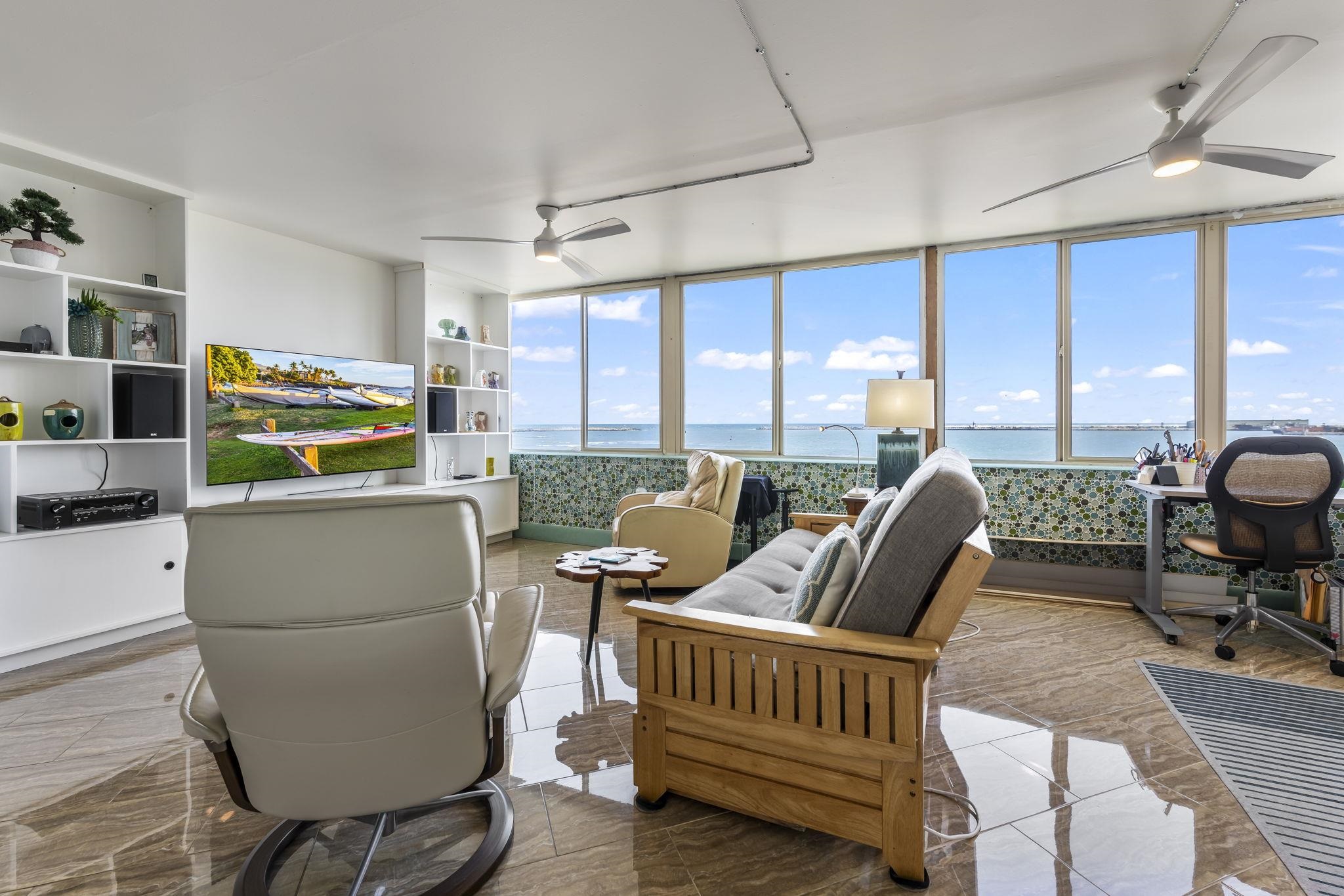 111 Kahului Beach Road, Unit A426 Kahului, HI 96732 - Photo 8 of 24 a living room with furniture and a floor to ceiling window