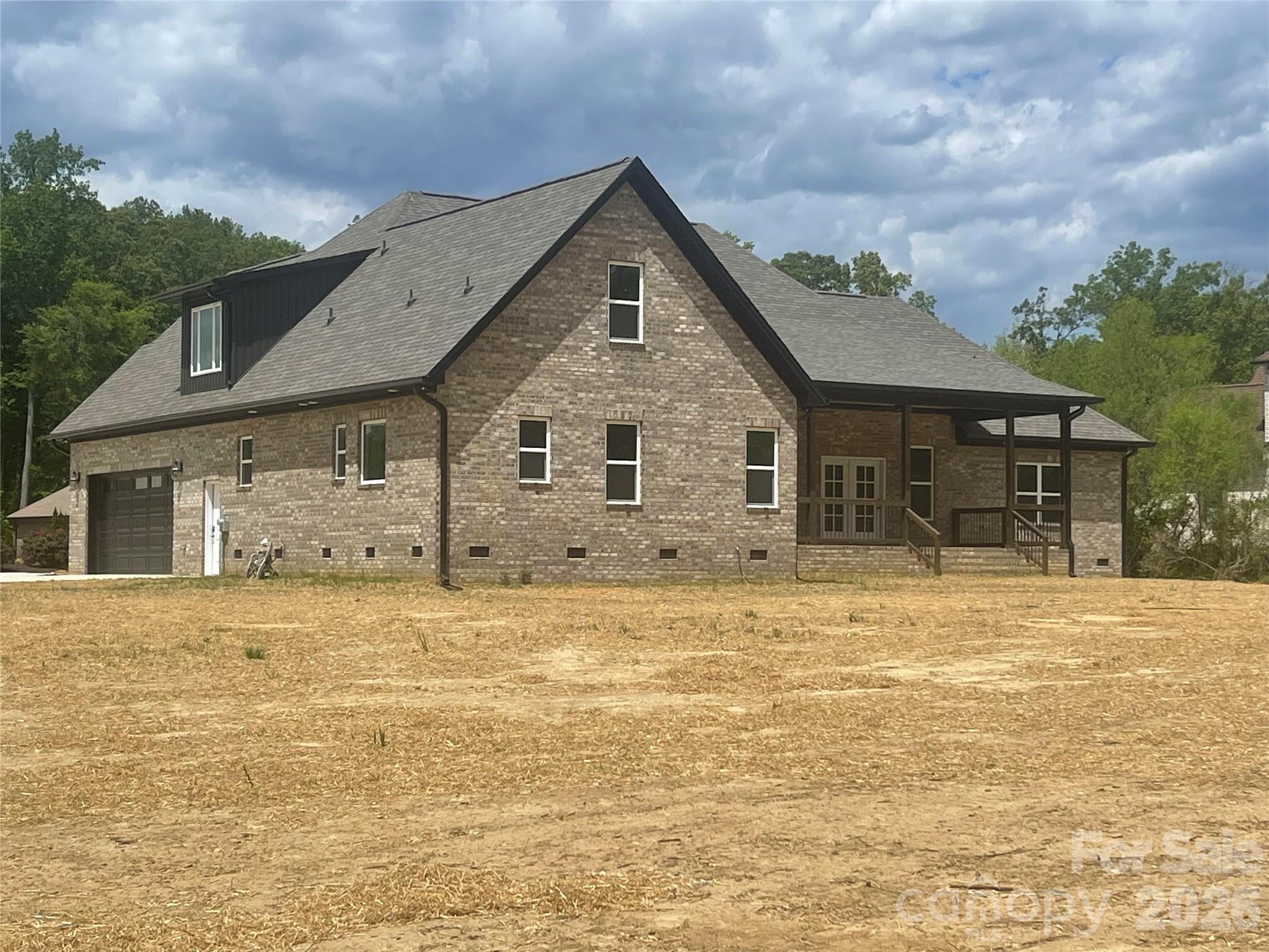 321 Stone Ridge Drive Salisbury, NC 28146 - Photo 3 of 39 a front view of a house with a garden