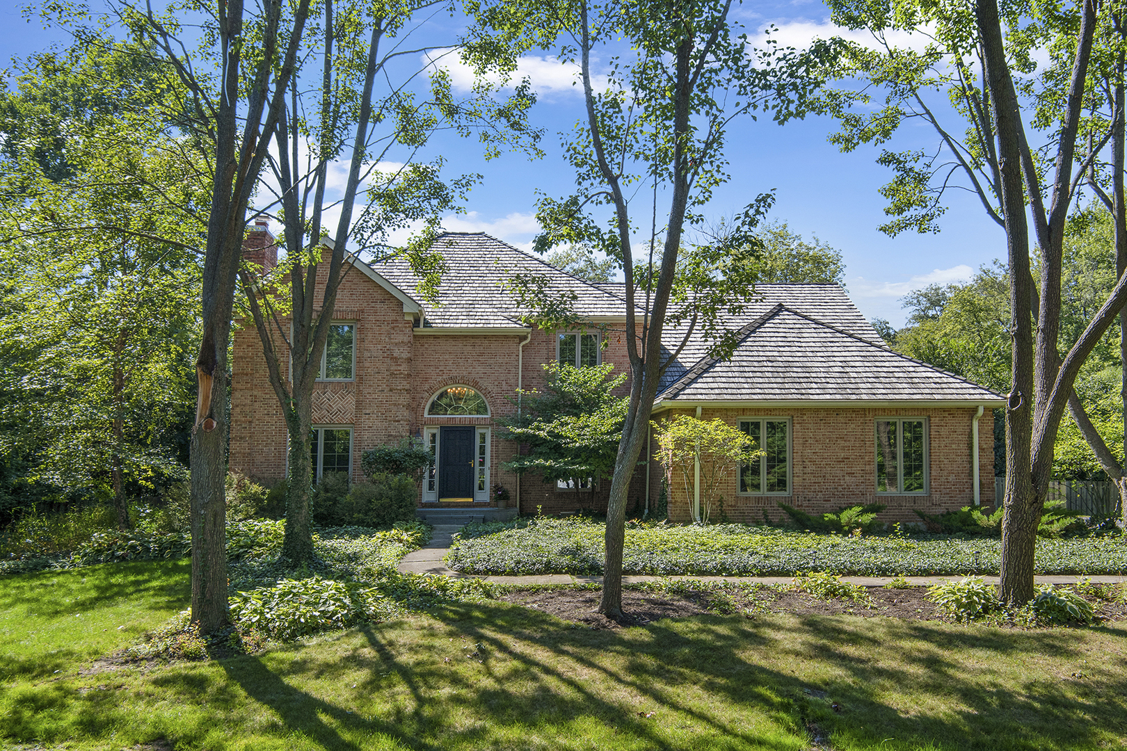 100 Boardman Court Lake Bluff, IL 60044 - Photo 1 of 33 a front view of a house with a yard