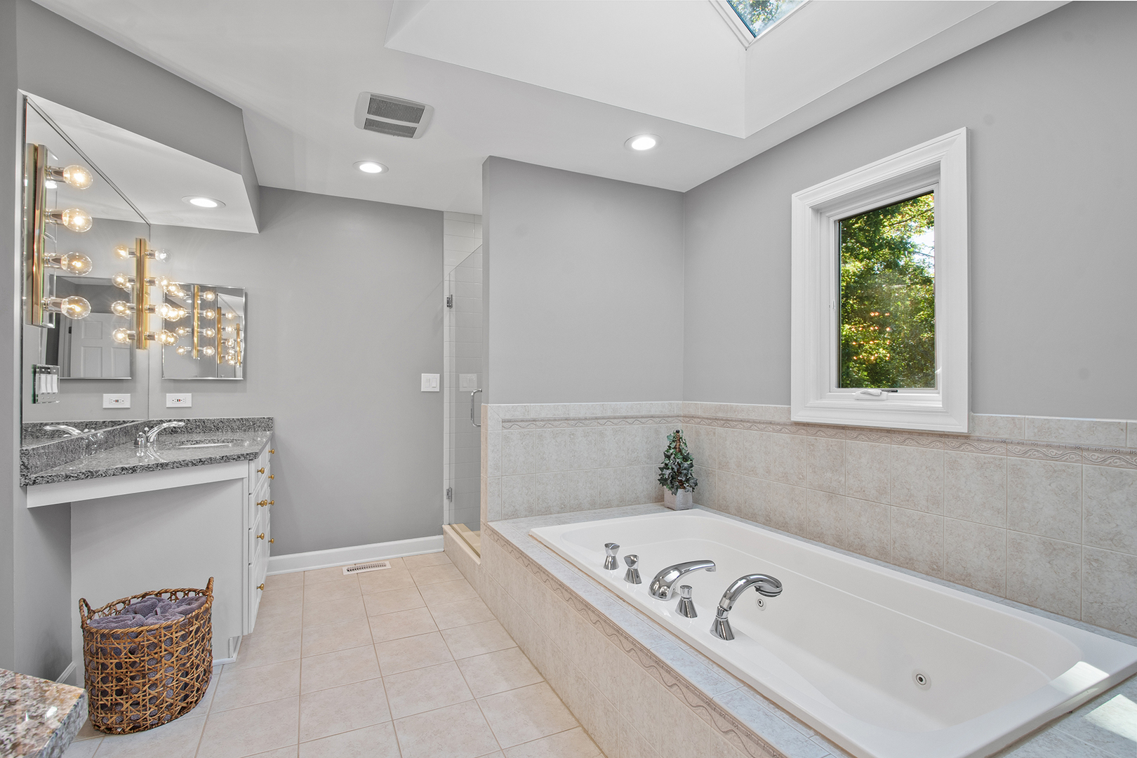 100 Boardman Court Lake Bluff, IL 60044 - Photo 21 of 33 a bathroom with a tub a sink and a window