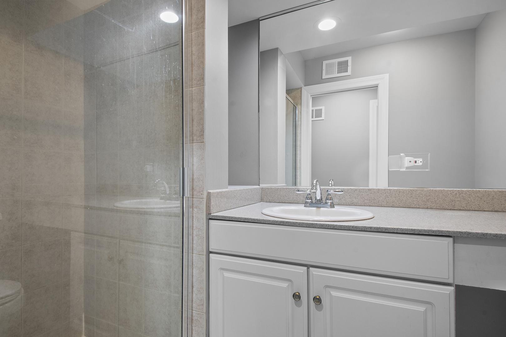 100 Boardman Court Lake Bluff, IL 60044 - Photo 24 of 33 a bathroom with a sink and a mirror