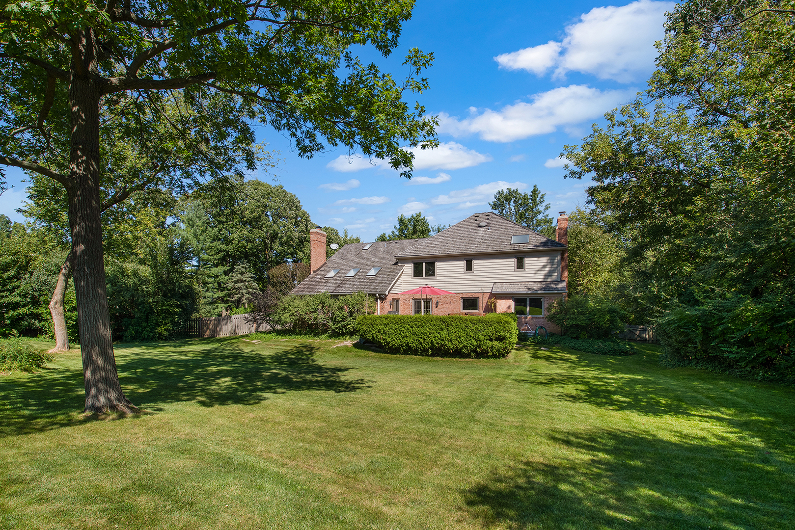 100 Boardman Court Lake Bluff, IL 60044 - Photo 28 of 33 a view of a house with a big yard plants and large trees