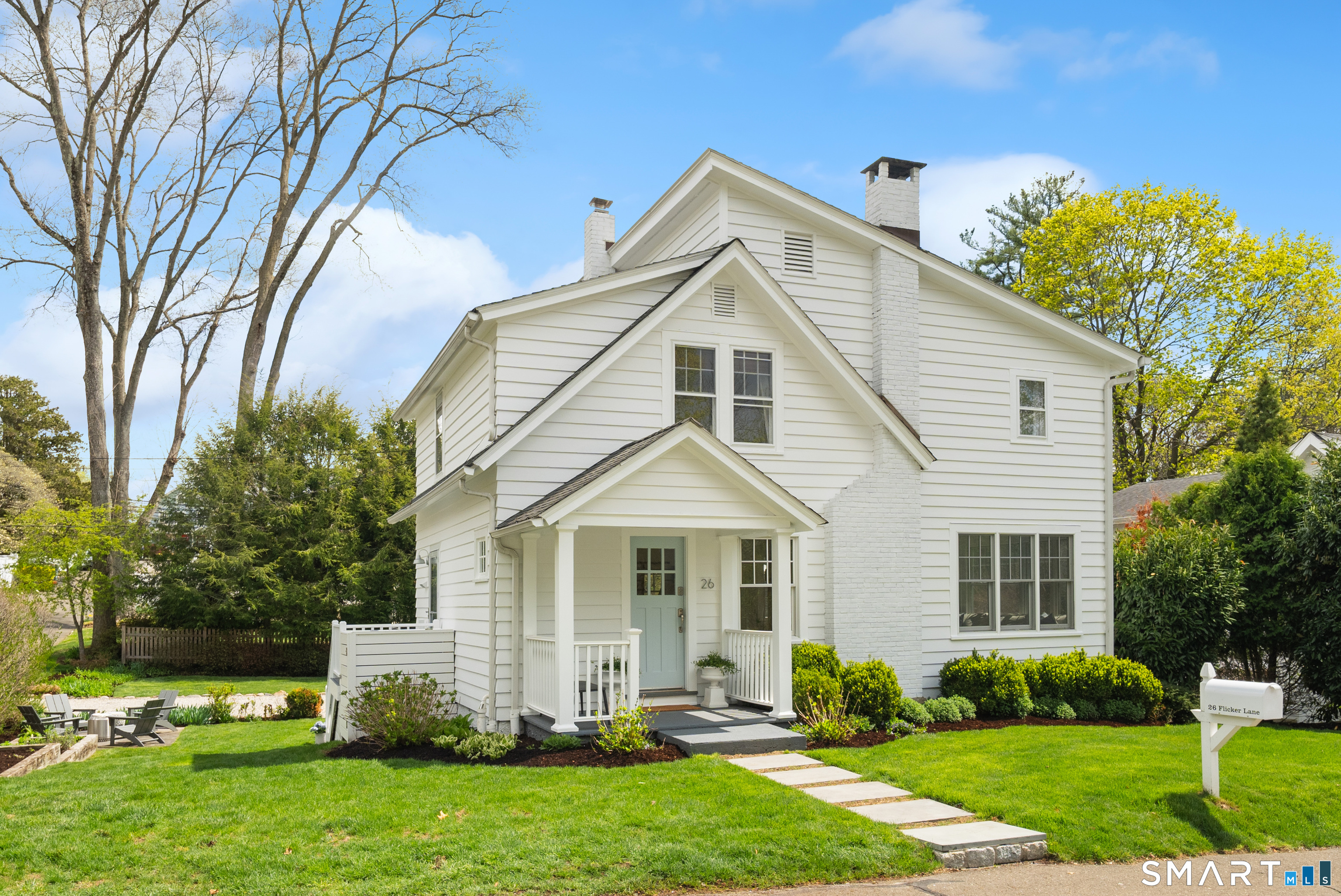 26 Flicker Lane Norwalk, CT 06853 - Photo 1 of 26 a front view of a house with a yard and trees