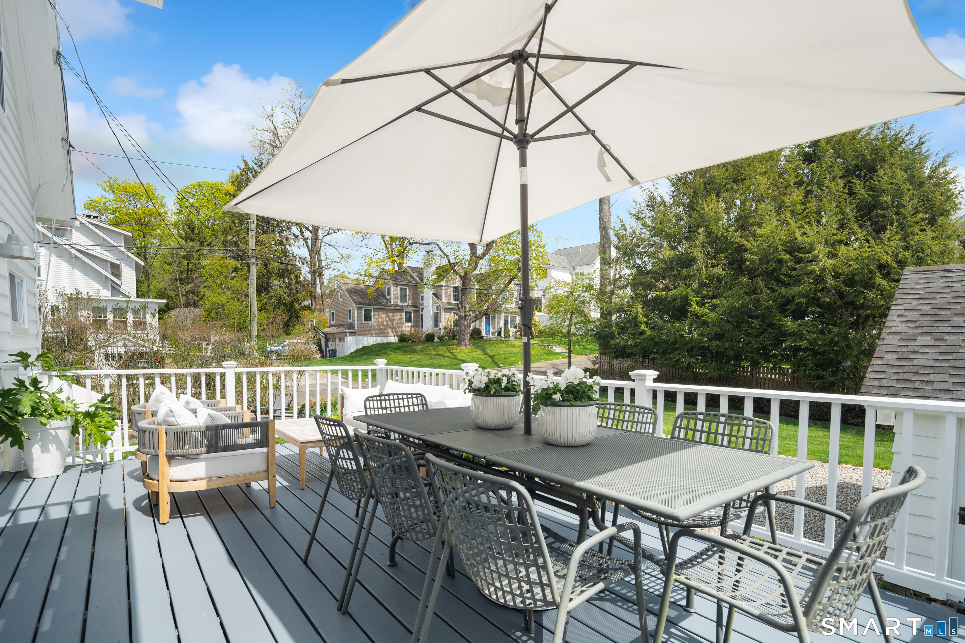 26 Flicker Lane Norwalk, CT 06853 - Photo 14 of 26 a view of a chairs and table on the deck