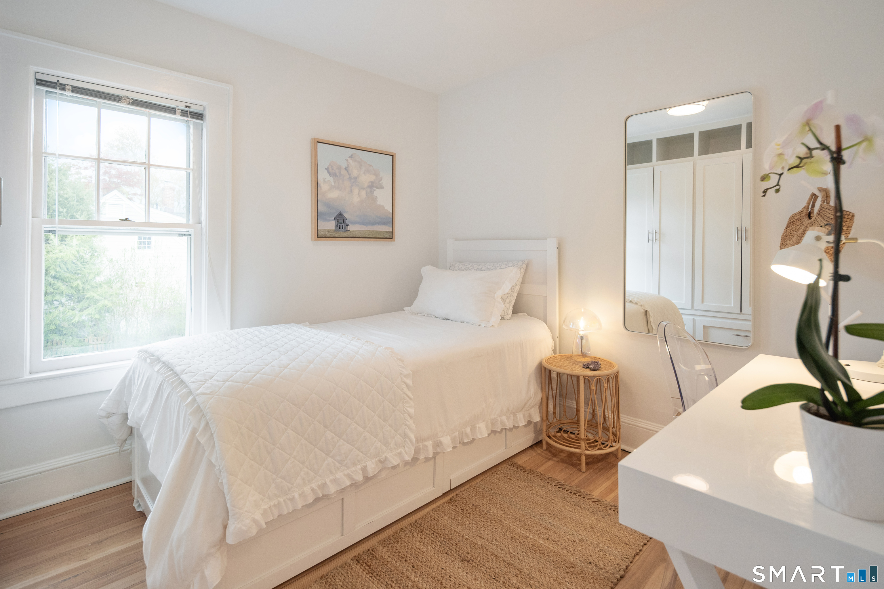 26 Flicker Lane Norwalk, CT 06853 - Photo 22 of 26 a bedroom with a bed and a window
