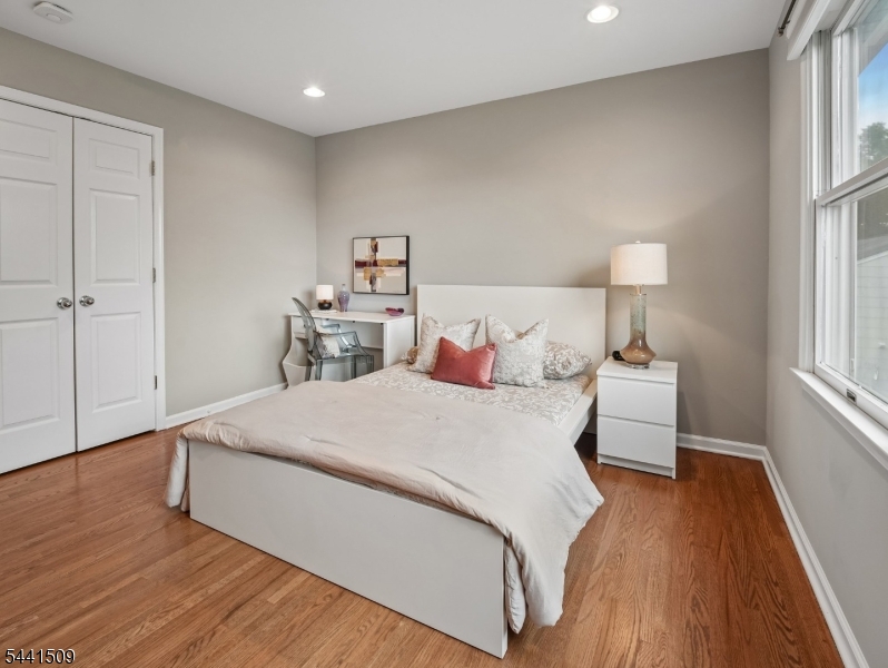 610 River Road Chatham, NJ 07928 - Photo 20 of 42 a bed room with a bed and a night stand
