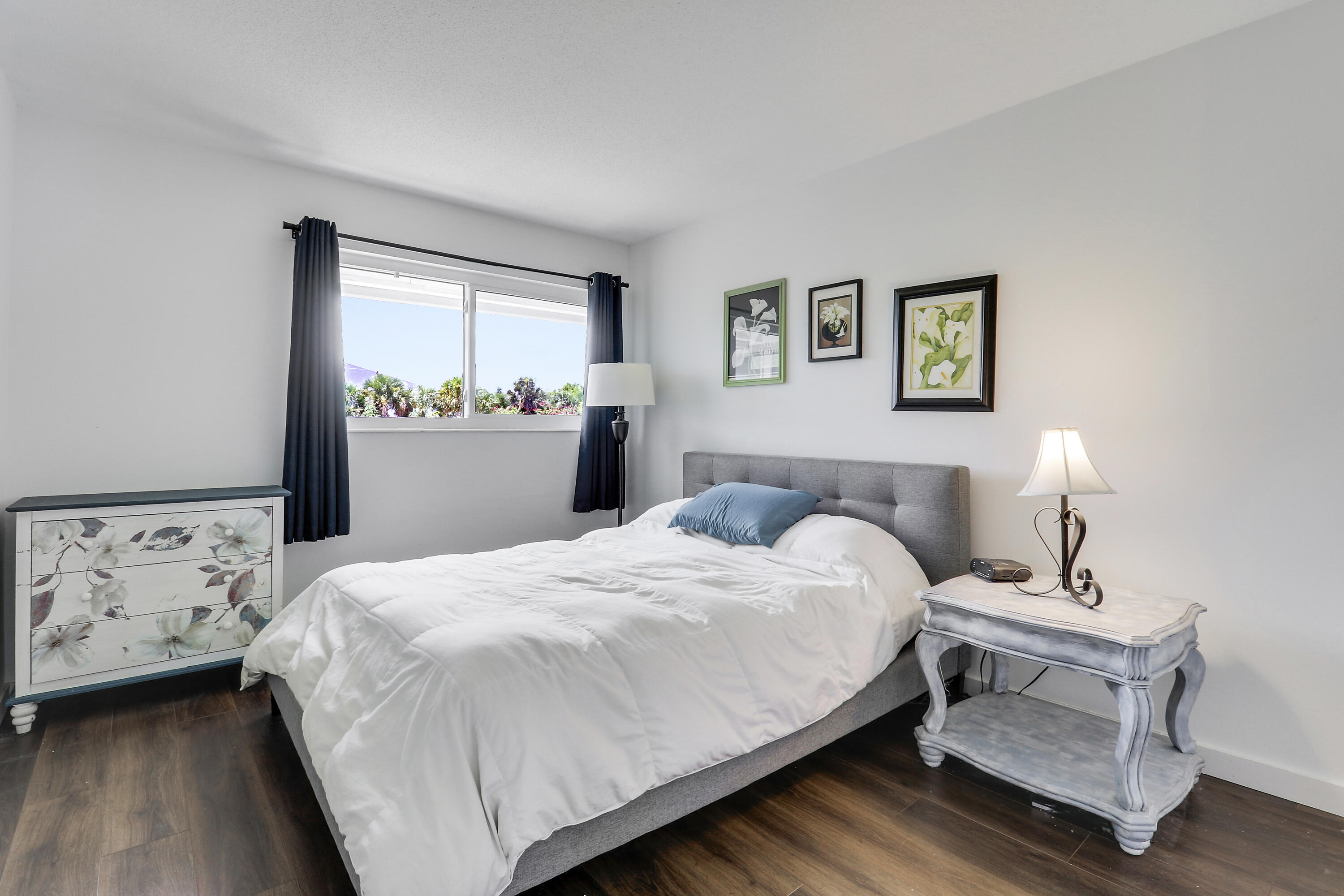 2929 Southeast Ocean Boulevard, Unit 19 Stuart, FL 34996 - Photo 11 of 19 a bedroom with a bed and a window