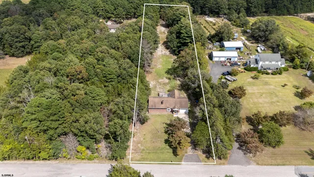 an aerial view of residential house with outdoor space
