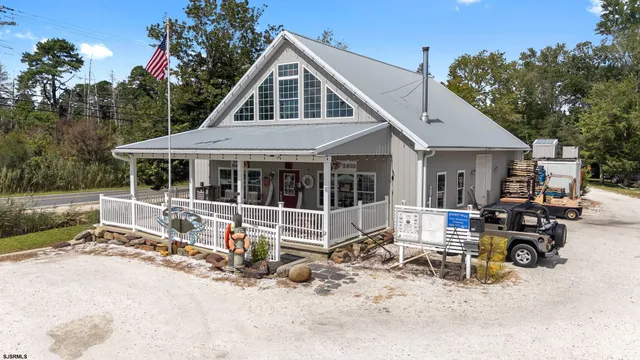 an aerial view of a house with yard swimming pool and outdoor seating