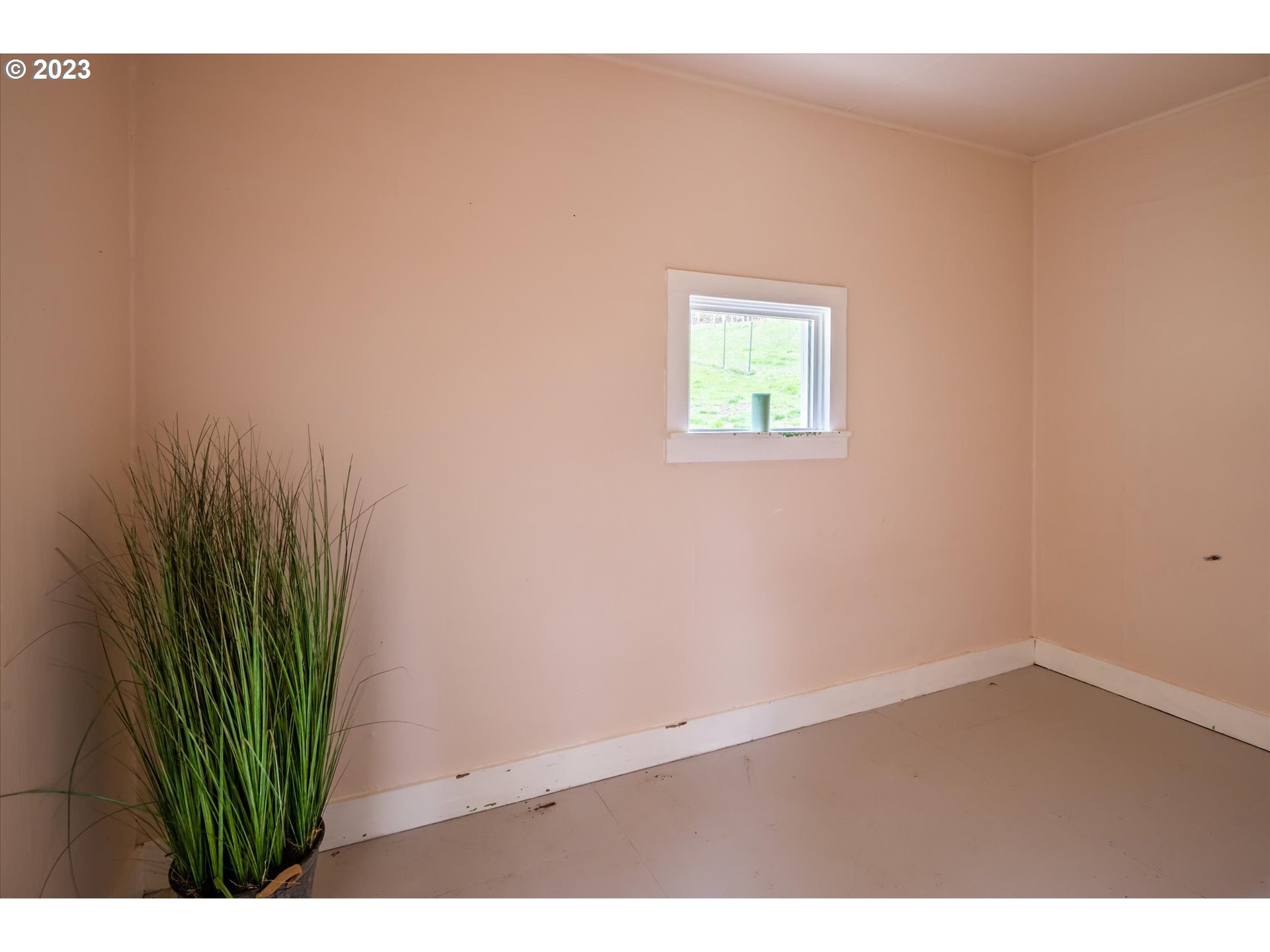 63657 Olive Barber Road Coos Bay, OR 97420 - Photo 12 of 34 a view of an empty room with wooden floor