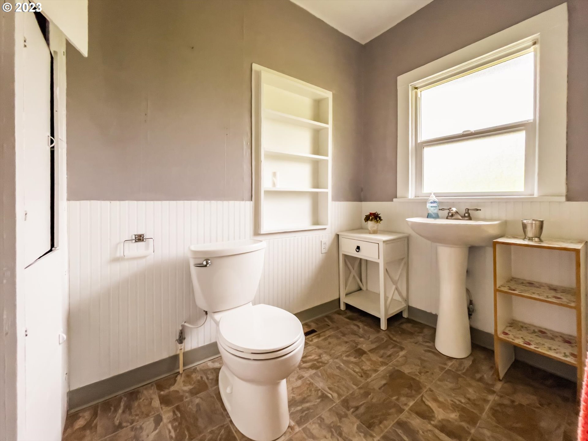 63657 Olive Barber Road Coos Bay, OR 97420 - Photo 16 of 34 a bathroom with a sink toilet vanity and window