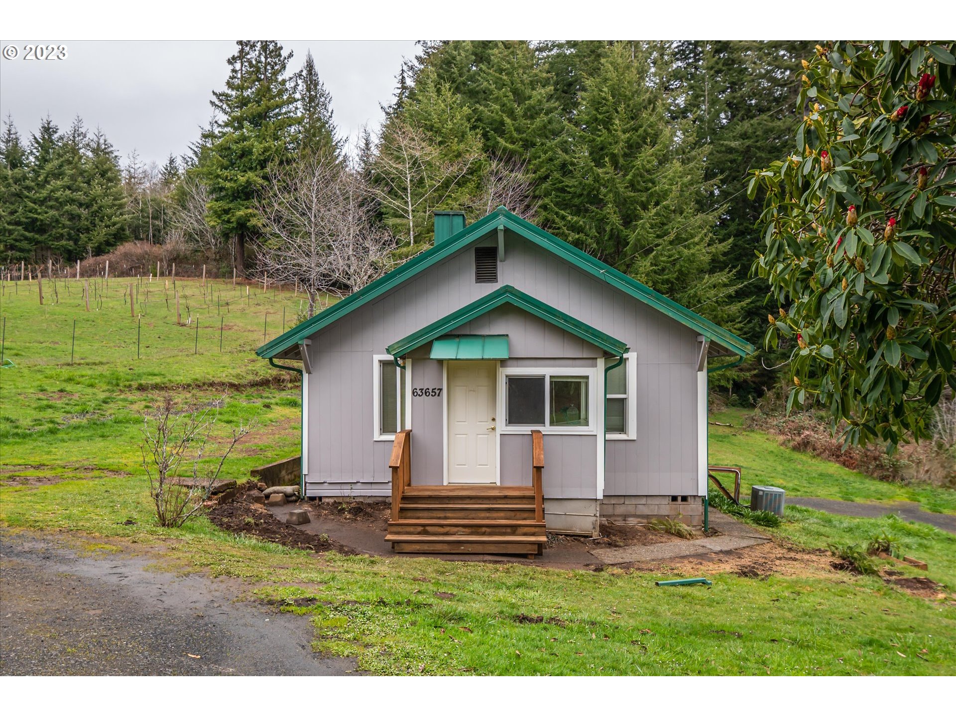63657 Olive Barber Road Coos Bay, OR 97420 - Photo 2 of 34 a view of a house with a yard