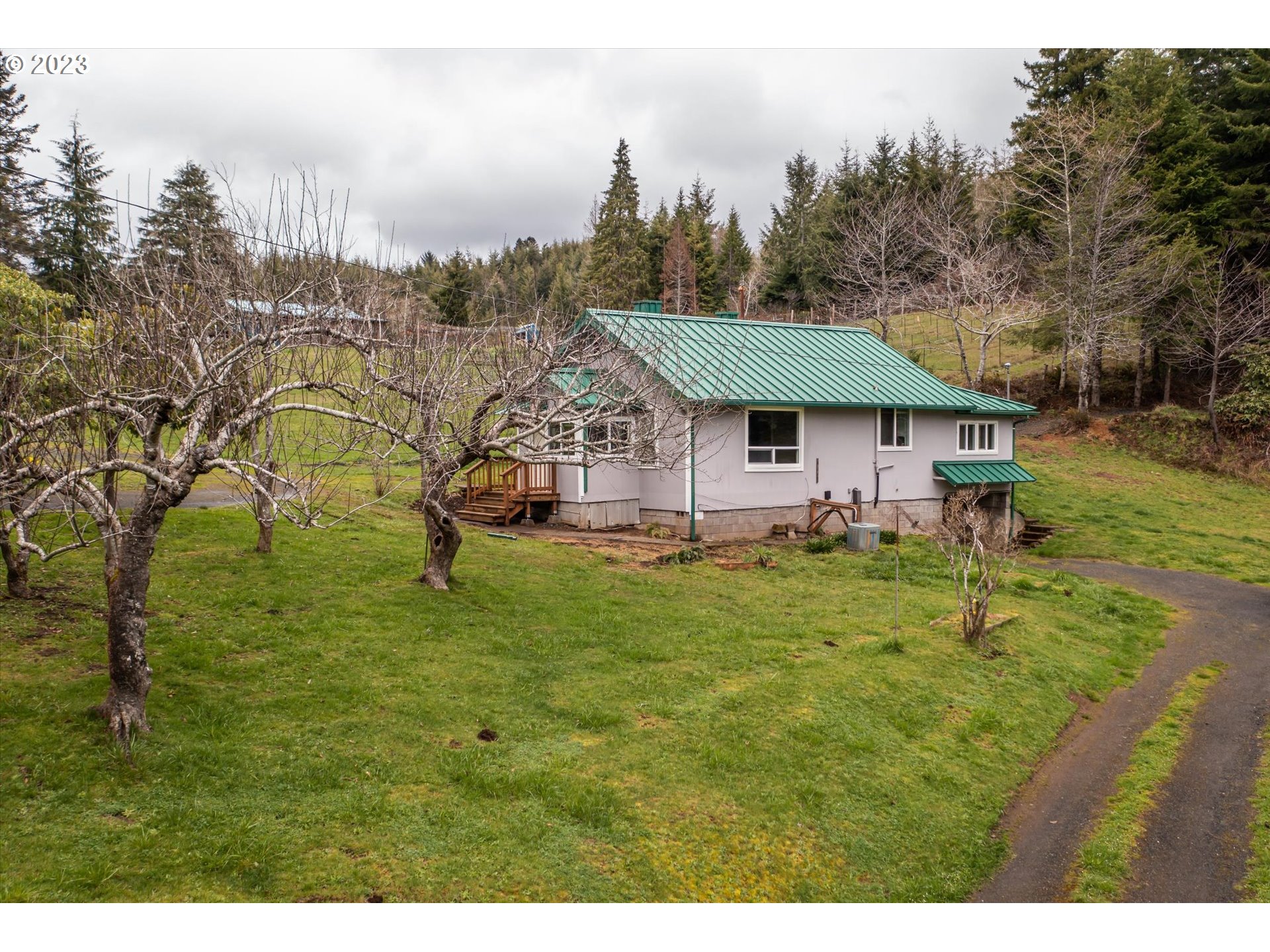 63657 Olive Barber Road Coos Bay, OR 97420 - Photo 23 of 34 a view of a house with a big yard