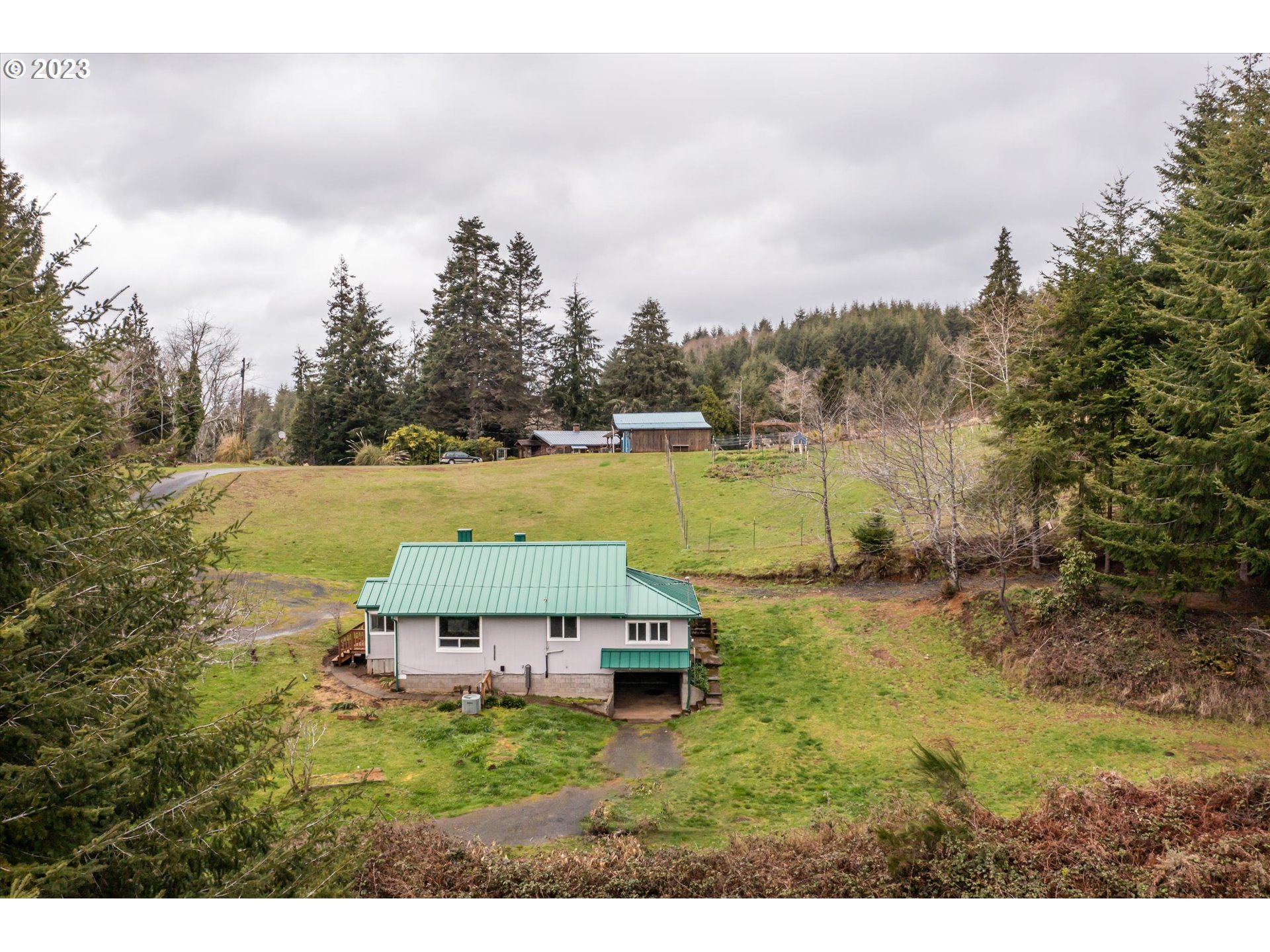 63657 Olive Barber Road Coos Bay, OR 97420 - Photo 25 of 34 a view of a garden with an outdoor space