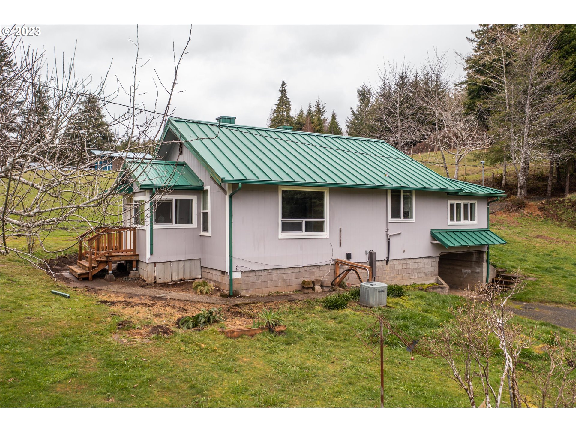 63657 Olive Barber Road Coos Bay, OR 97420 - Photo 26 of 34 a house view with a sitting space fire pit and outdoor space