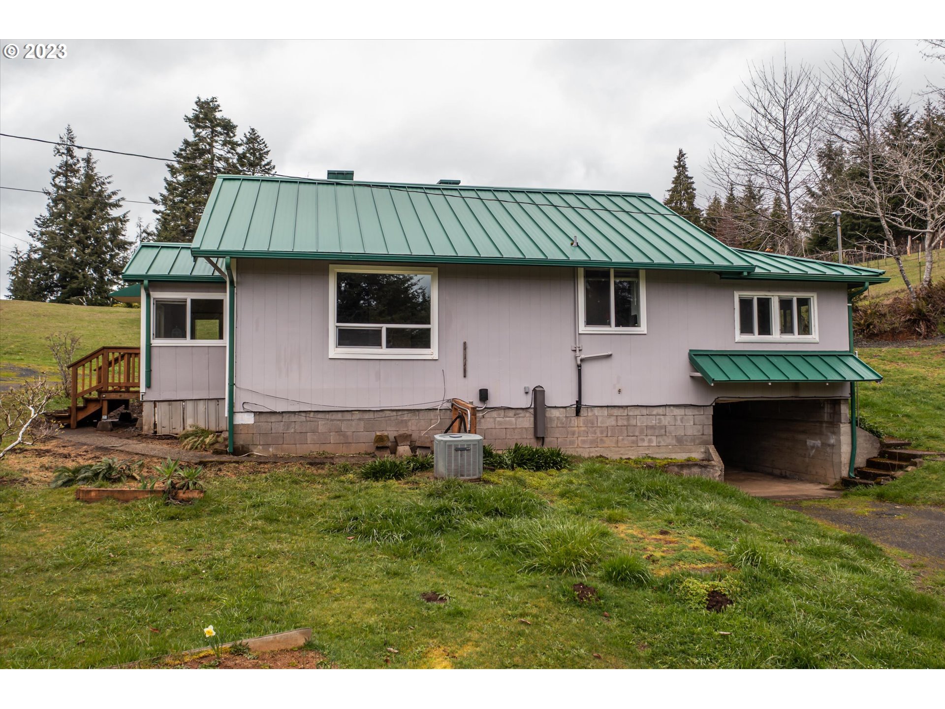 63657 Olive Barber Road Coos Bay, OR 97420 - Photo 27 of 34 a view of a house with a yard