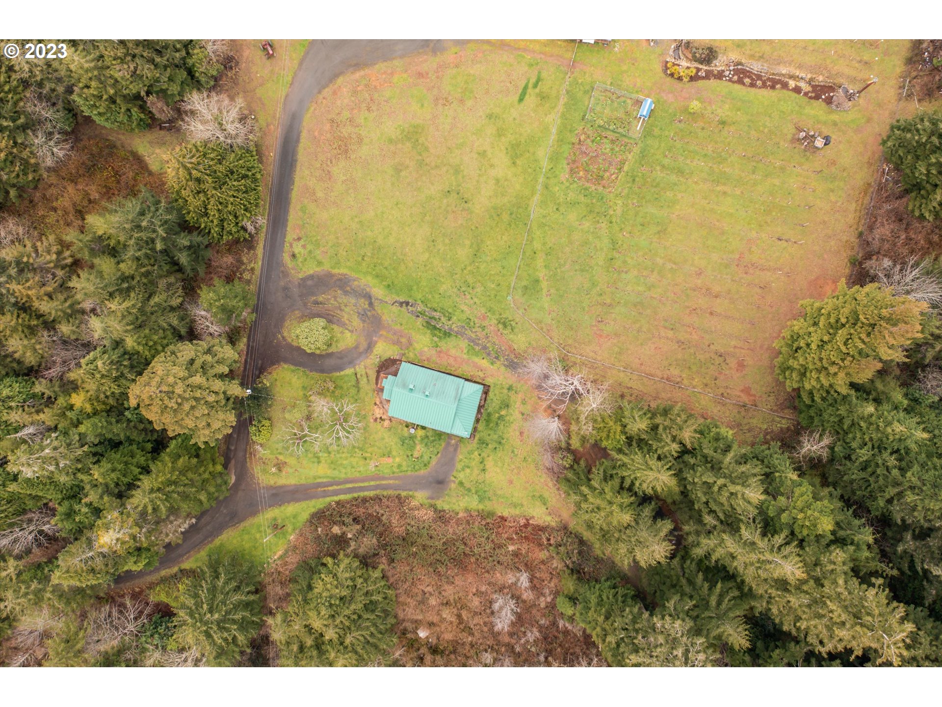 63657 Olive Barber Road Coos Bay, OR 97420 - Photo 28 of 34 a bird view of residential house and swimming pool