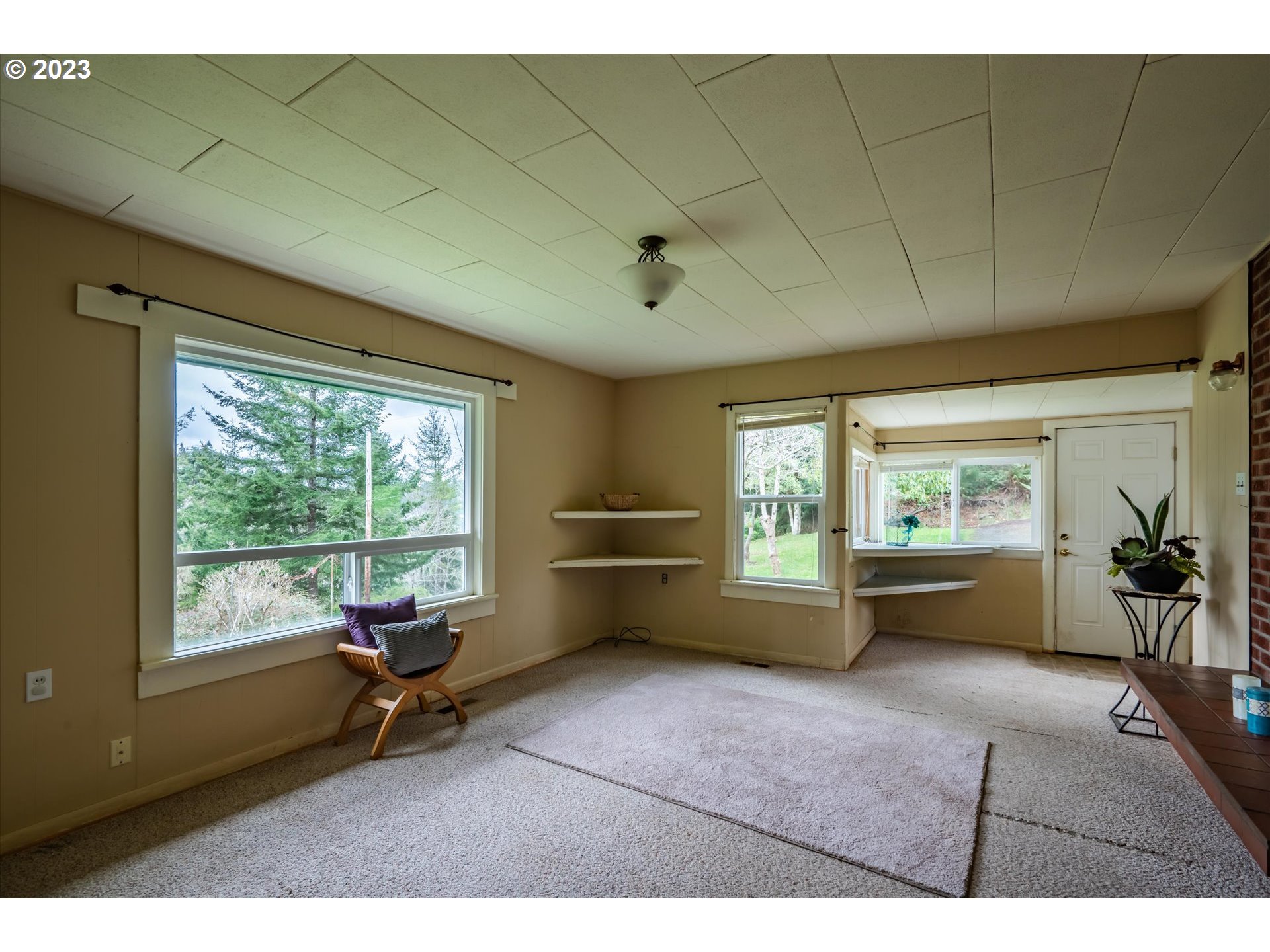 63657 Olive Barber Road Coos Bay, OR 97420 - Photo 8 of 34 a living room with furniture and a large window