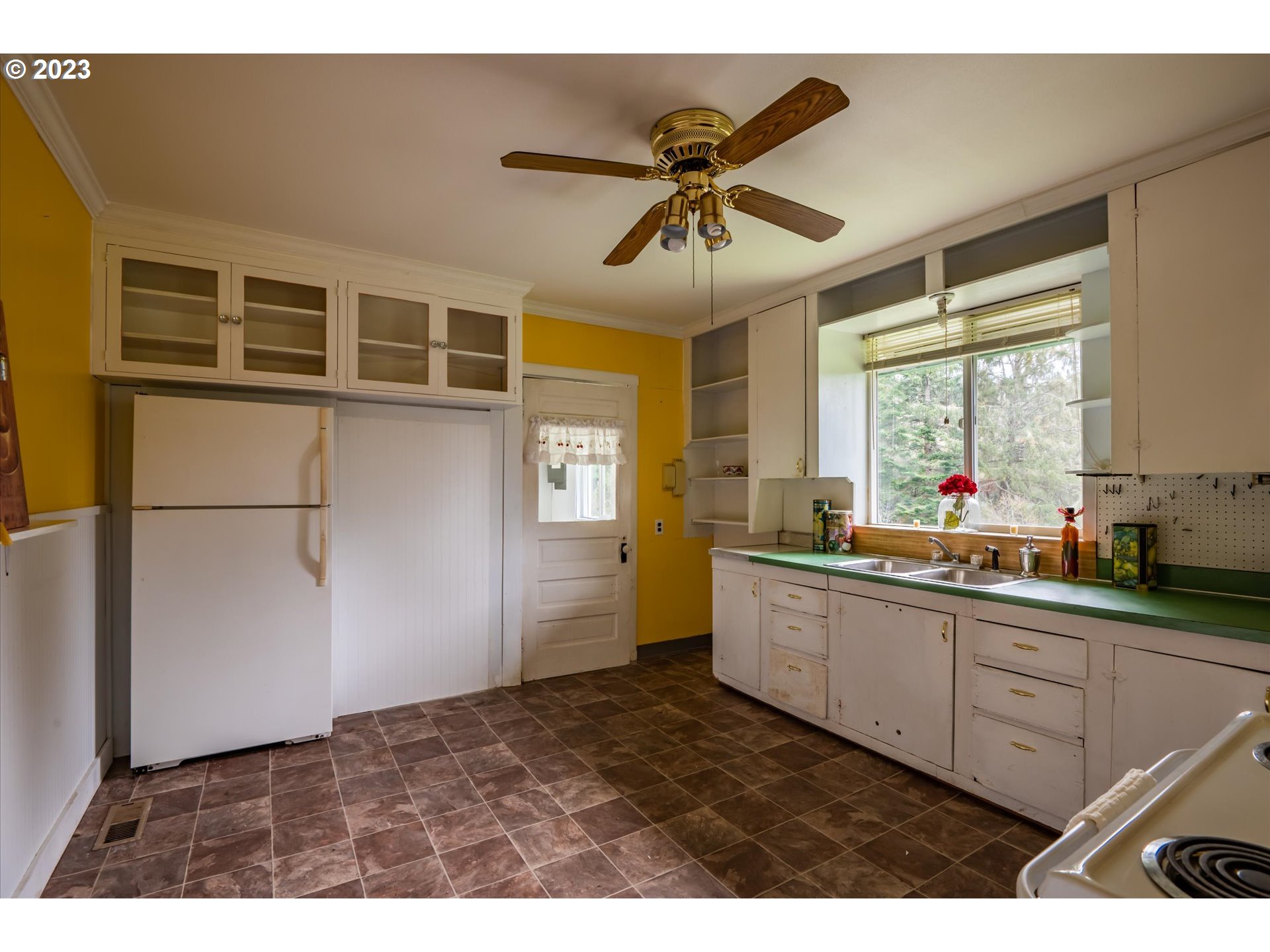63657 Olive Barber Road Coos Bay, OR 97420 - Photo 9 of 34 a kitchen with stainless steel appliances a sink a stove and cabinets