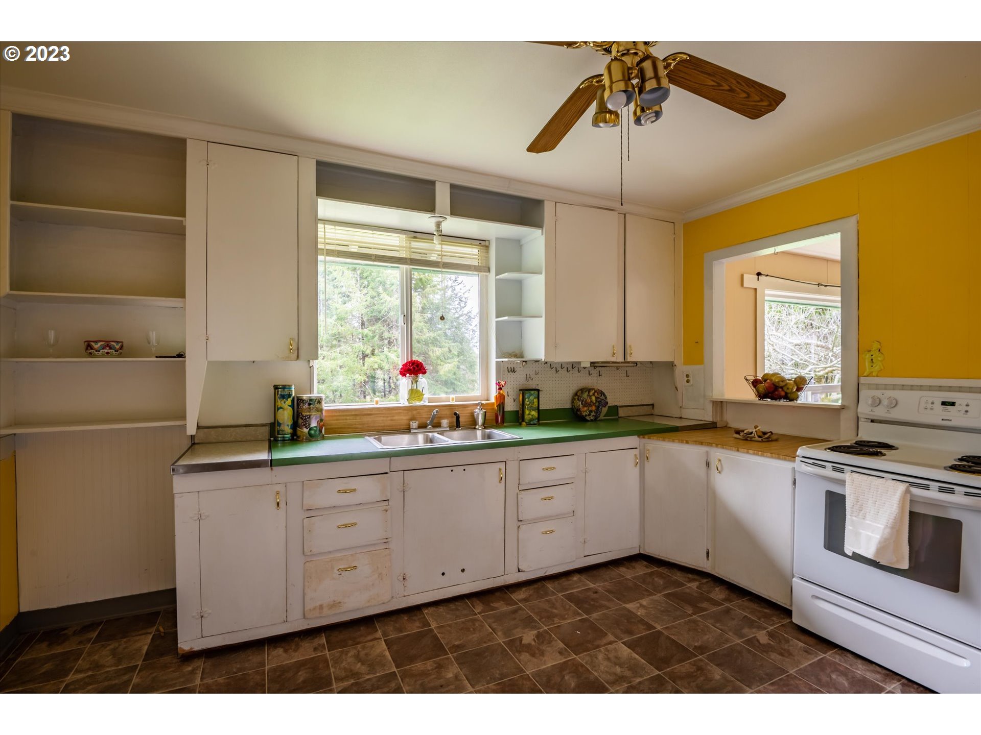 63657 Olive Barber Road Coos Bay, OR 97420 - Photo 10 of 34 a kitchen with stainless steel appliances a sink and cabinets